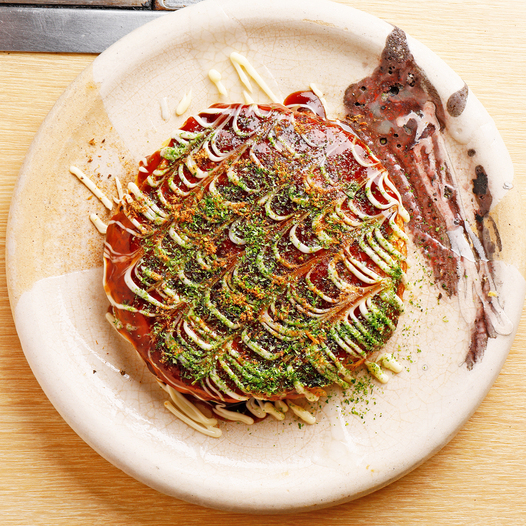 Rice-flour okonomiyaki served on a plate